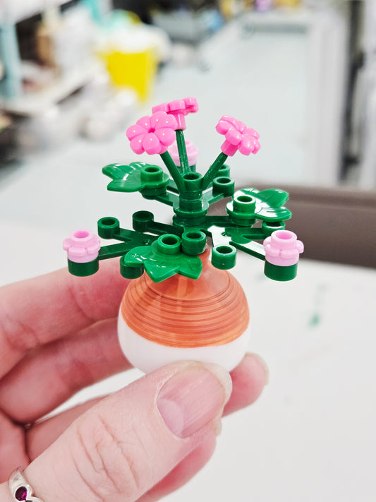 Pink Flowers in Orange/White Vase